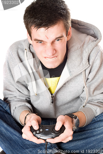 Image of Portrait of furious young man with a joystick