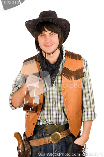 Image of young cowboy with a bottle