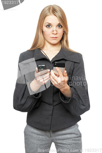 Image of Surprised young blonde in a gray business suit