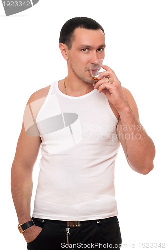 Image of Man with a glass of whiskey