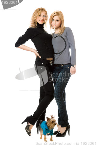 Image of Two beautiful young women with dog