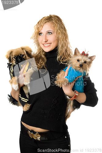 Image of Portrait of cheerful young blonde with two dogs