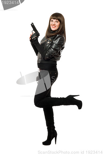 Image of Smiling armed girl in boots