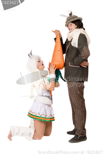 Image of Funny young couple with carrot