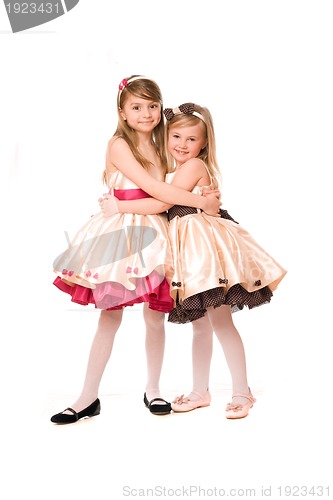 Image of Two attractive little girls in a dress