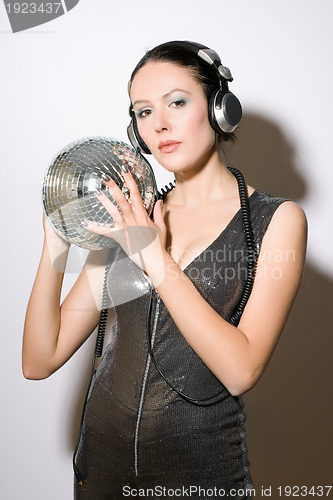 Image of Portrait of nice young woman in headphones