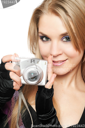 Image of Smiling beautiful blonde holding a photo camera