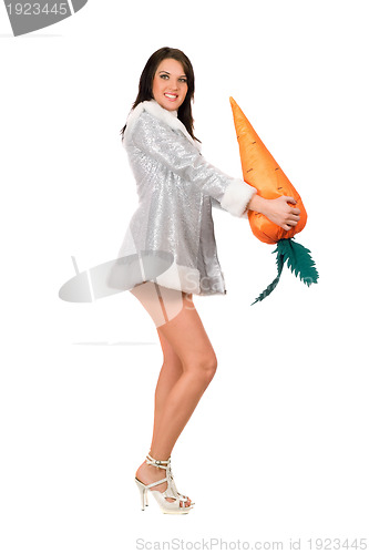 Image of Beautiful young brunette with a carrot
