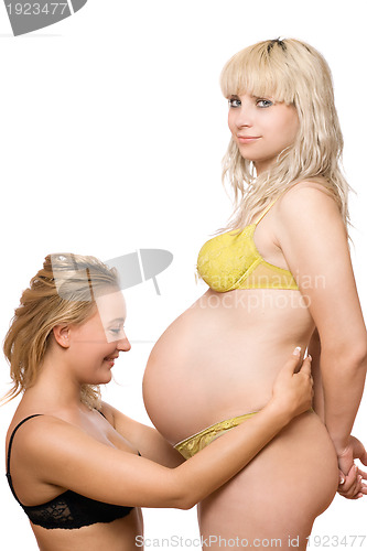 Image of young woman and a pregnant girlfriend