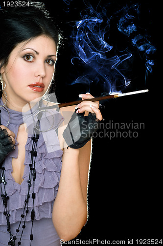 Image of Portrait of a brunette with cigarette holder