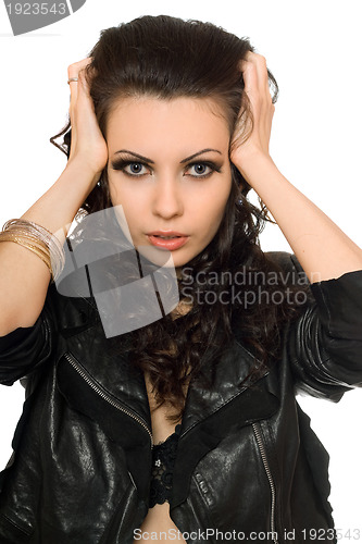 Image of Closeup portrait of beautiful brunette in black clothes