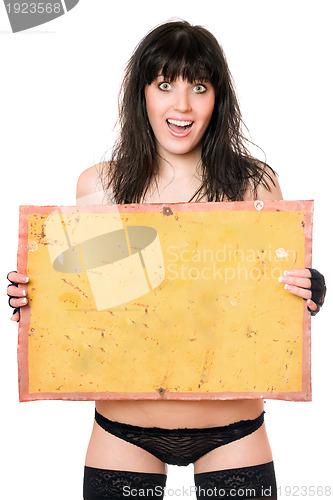 Image of Surprised brunette taking vintage yellow board