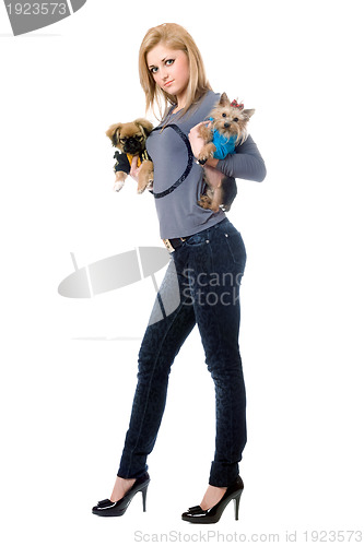 Image of Pretty young blonde posing with two dogs