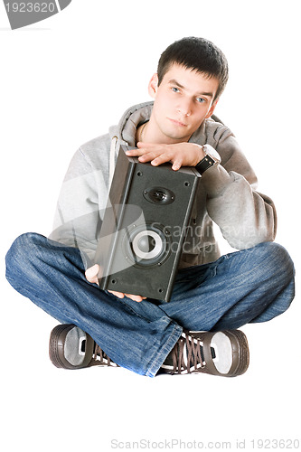 Image of Young man with a speaker in his hands