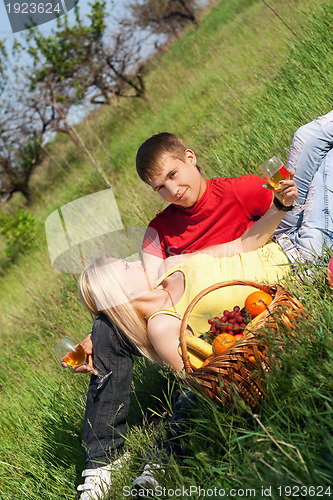 Image of Pretty blonde and young man with wineglasses 