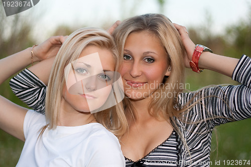 Image of Closeup portrait of two attractive young women