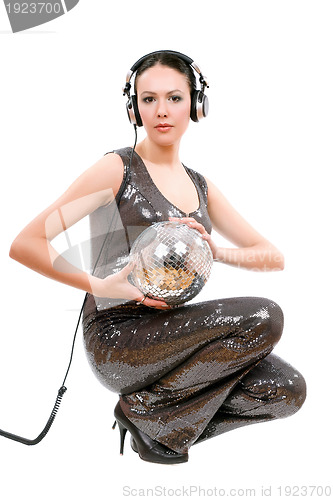 Image of Young brunette in headphones