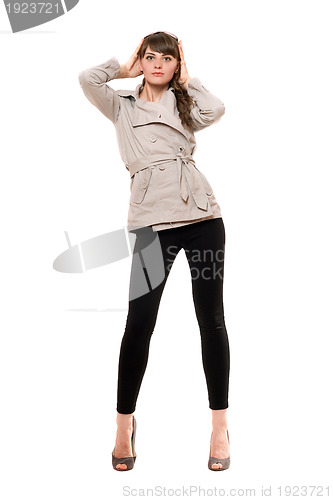 Image of Attractive young woman wearing a coat 