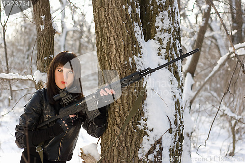 Image of Pretty woman with a sniper rifle 