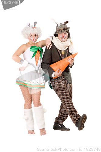 Image of couple with carrot dressed as rabbits