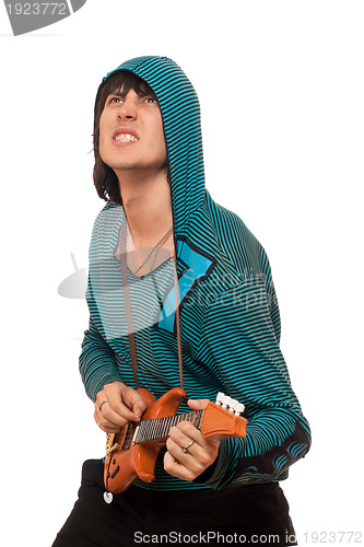 Image of Expressive man with a little guitar