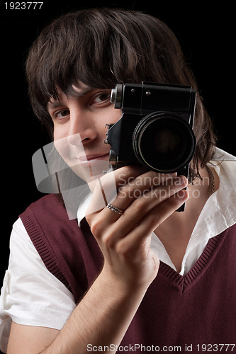 Image of Smiling photographer with the vintage camera