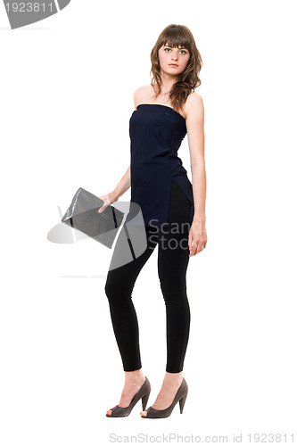 Image of Charming girl in a black leggings. Isolated