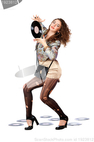 Image of woman with vinyl disc in a hands