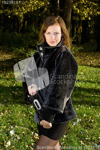 Image of playful young woman outdoors