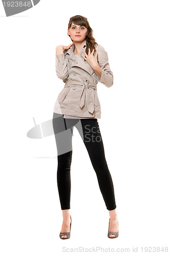 Image of Charming young woman wearing a coat 