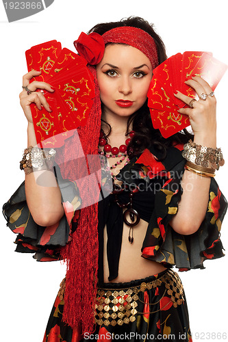 Image of Portrait of expressive gypsy woman with cards