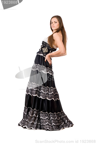 Image of Attractive young woman in long dress