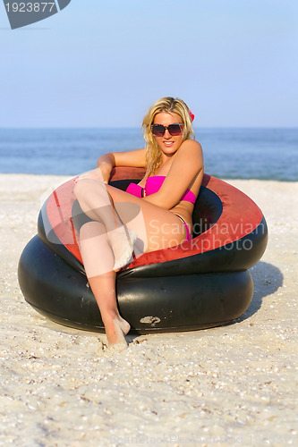 Image of Beautiful girl sitting in an inflatable chair