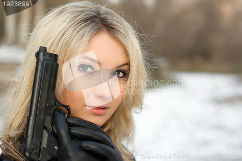 Image of Sweet woman with a weapon