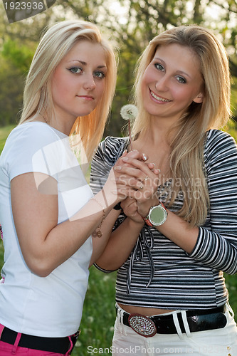 Image of Two smiling young blonde