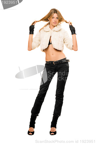 Image of blonde in a fur coat and black jeans