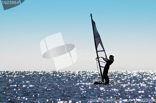 Image of Silhouette of a girl windsurfer
