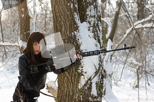 Image of Gorgeous woman with a sniper rifle