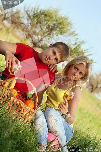 Image of Attractive blonde and young man with wineglasses