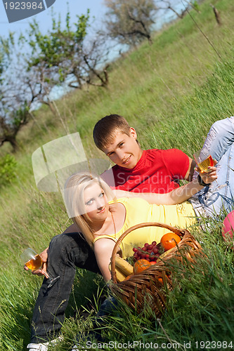 Image of Beautiful blonde and young man with wineglasses