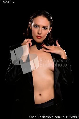Image of Attractive young woman wearing a black suit