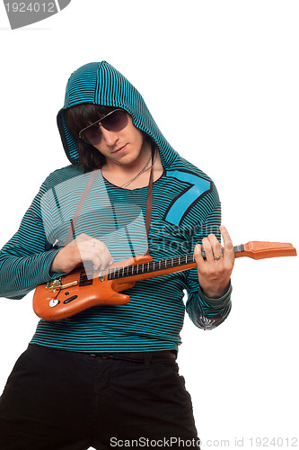 Image of Young man in sunglasses with a little guitar
