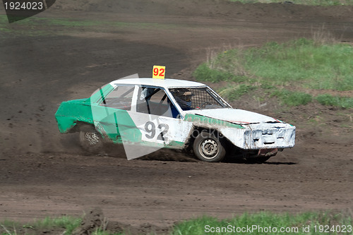 Image of Race for survival. Green white car