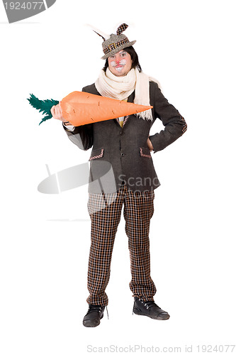 Image of Smiling young man with carrot