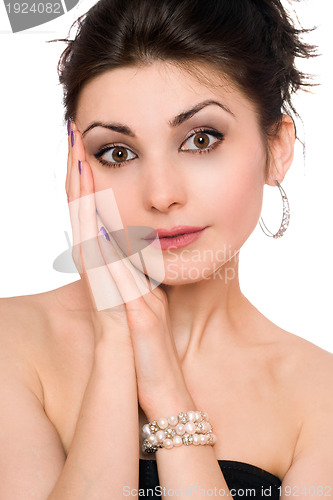 Image of Portrait of beautiful young brunette in a black dress. Isolated