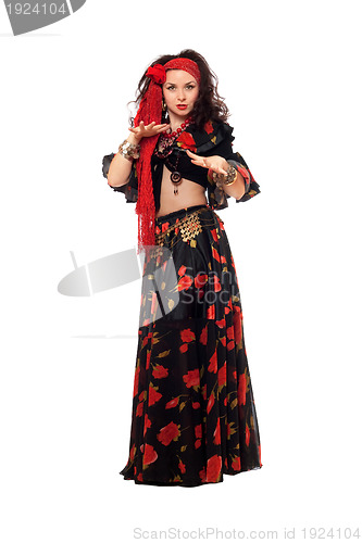 Image of Sensual gypsy woman in a black skirt. Isolated