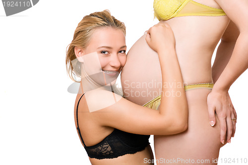 Image of girl and belly of pregnant girlfriend