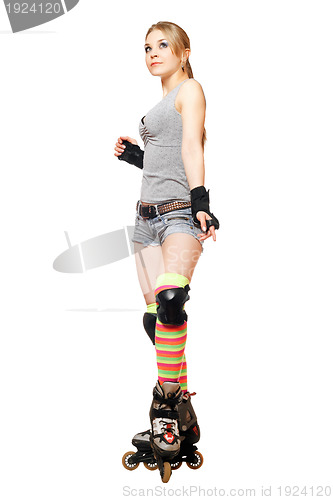 Image of Pretty young blonde on roller skates