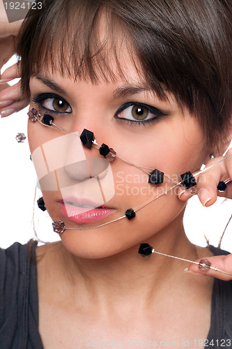 Image of Closeup portrait of brunette with a bead