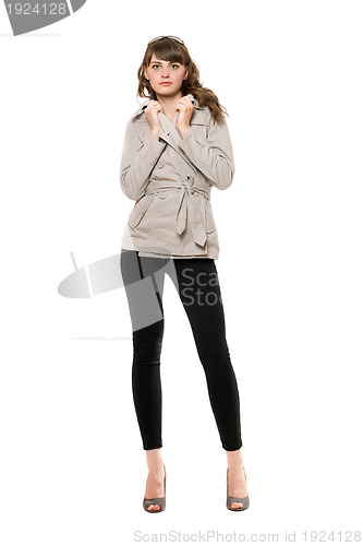 Image of Cute young woman wearing a coat